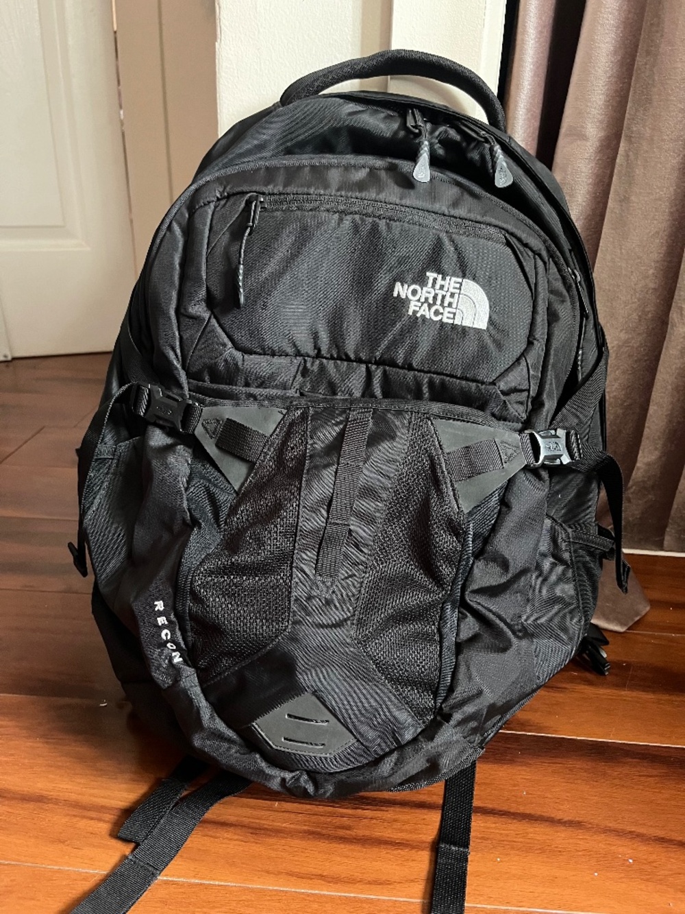 North Face backpack with laptop compartment and bike helmet net